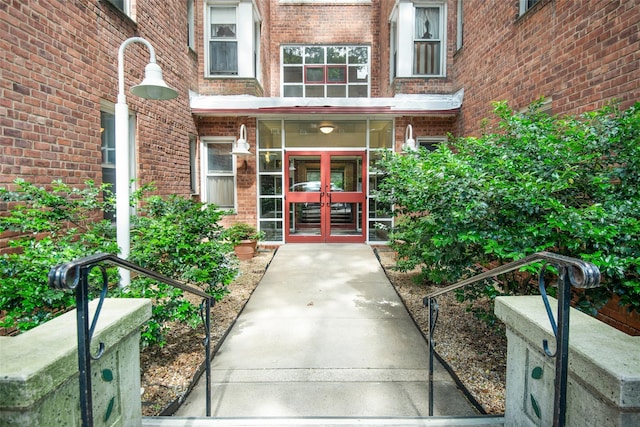 1 Georgia Ave Unit 5A, Bronxville, NY 10708 - view of exterior entry with french doors and brick siding