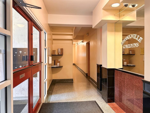 1 Georgia Ave Unit 5A, Bronxville, NY 10708 - hall featuring speckle patterned floor and baseboards