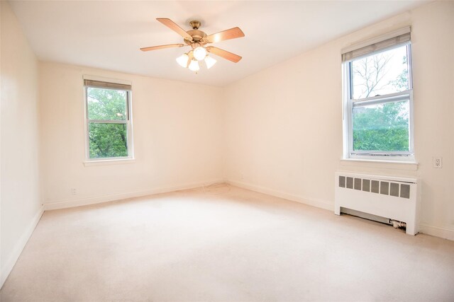 1 Georgia Ave Unit 5A, Bronxville, NY 10708 - empty room featuring radiator heating unit, carpet floors, and baseboards