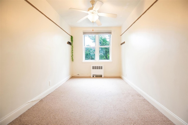 1 Georgia Ave Unit 5A, Bronxville, NY 10708 - spare room with radiator, light colored carpet, ceiling fan, and baseboards