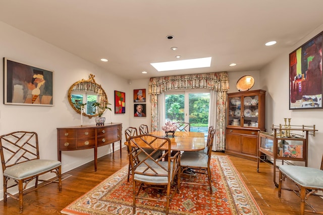 301 Margaret Blvd, Merrick, NY 11566 - dining room featuring a skylight, wood finished floors, and recessed lighting
