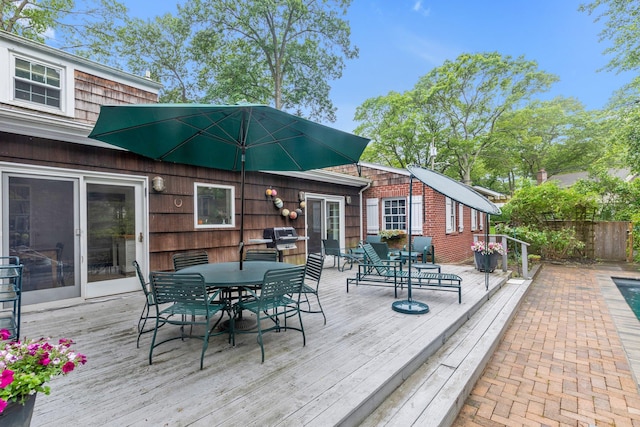 301 Margaret Blvd, Merrick, NY 11566 - wooden deck featuring outdoor dining area and a grill