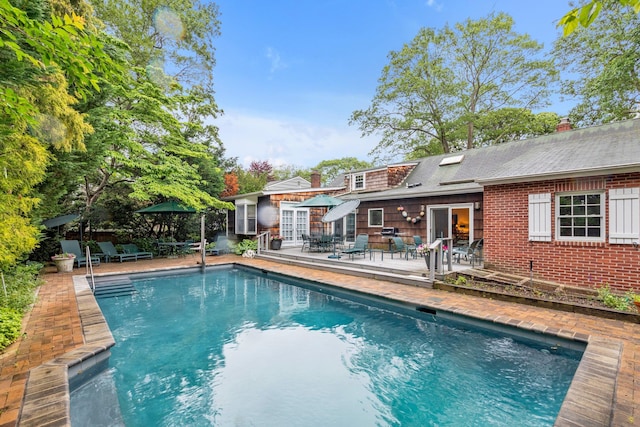 301 Margaret Blvd, Merrick, NY 11566 - outdoor pool featuring outdoor dining area, a patio, and french doors