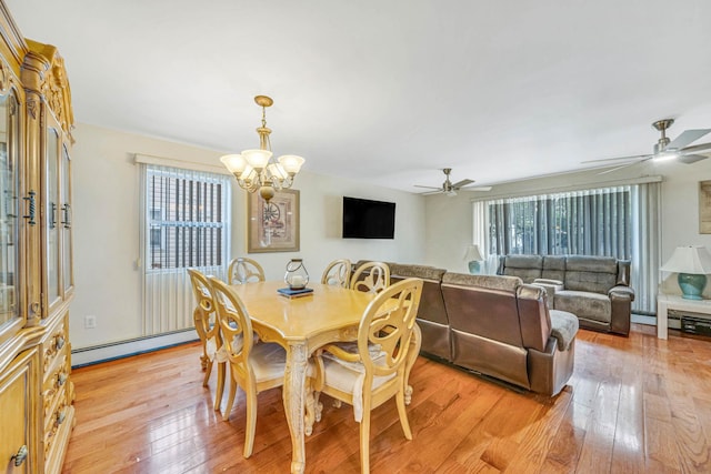 14015 159th St, Jamaica, NY 11434 - dining space featuring baseboard heating, light wood finished floors, and a ceiling fan