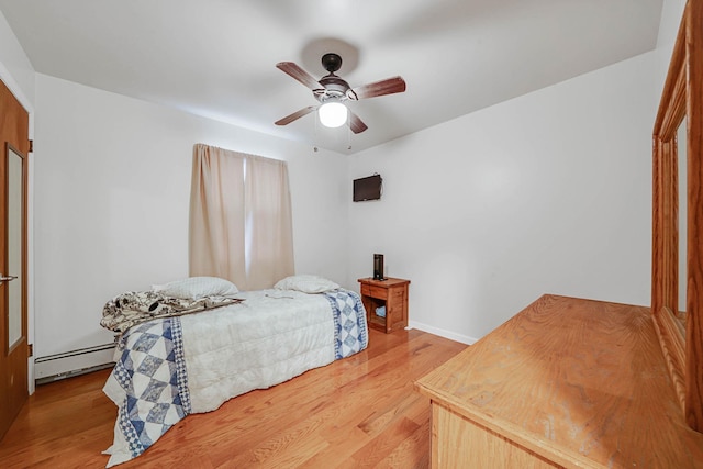 14015 159th St, Jamaica, NY 11434 - bedroom featuring light wood-style floors, baseboard heating, and ceiling fan