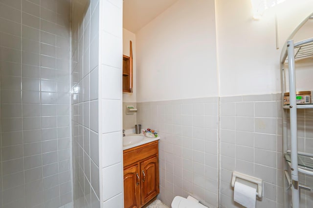 14015 159th St, Jamaica, NY 11434 - bathroom with tile walls, vanity, and wainscoting