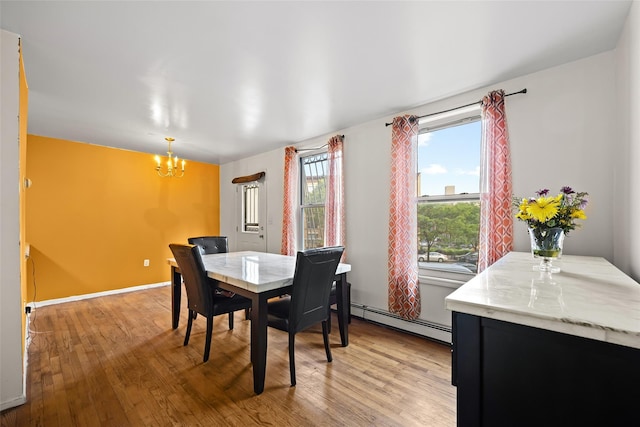 1830 Sterling Pl, Brooklyn, NY 11233 - dining space featuring a baseboard radiator, a chandelier, and light wood finished floors