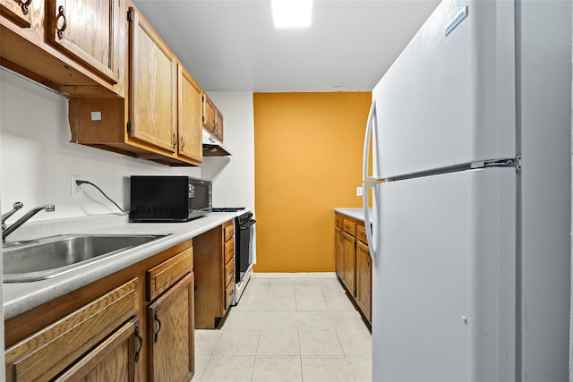 1830 Sterling Pl, Brooklyn, NY 11233 - kitchen featuring freestanding refrigerator, black microwave, range, a sink, and under cabinet range hood