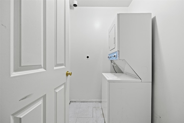1830 Sterling Pl, Brooklyn, NY 11233 - washroom with estacked washer and dryer and baseboards