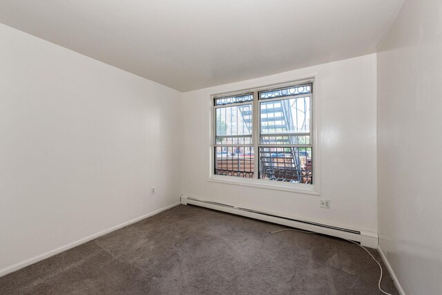 1830 Sterling Pl, Brooklyn, NY 11233 - carpeted spare room featuring a baseboard heating unit and baseboards