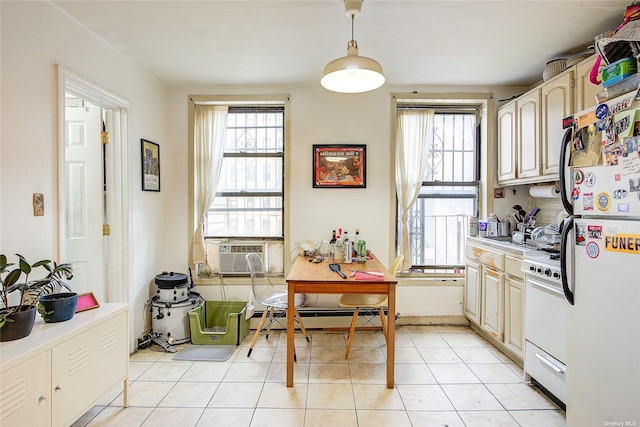 230 S 2nd St, Brooklyn, NY 11211 - kitchen featuring white appliances, healthy amount of natural light, light countertops, and a baseboard radiator