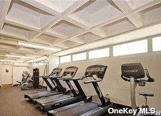 150-38 Union Tpke Unit 11G, Flushing, NY 11367 - workout area with coffered ceiling, beam ceiling, and baseboards