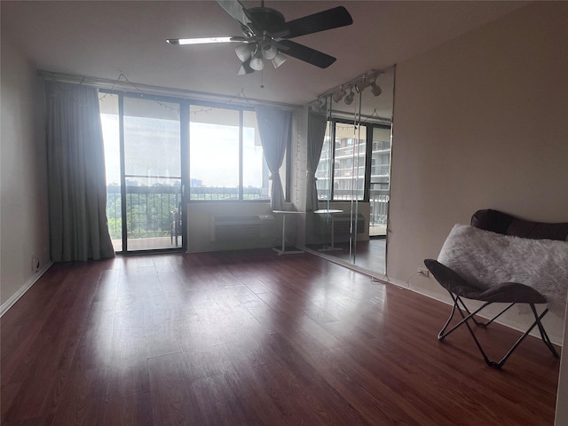 150-38 Union Tpke Unit 11G, Flushing, NY 11367 - unfurnished room featuring wood finished floors, a ceiling fan, and floor to ceiling windows