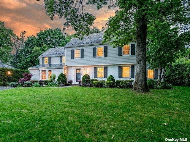 22 Homer Pl, Manhasset, NY 11030 - view of front of home with a front lawn