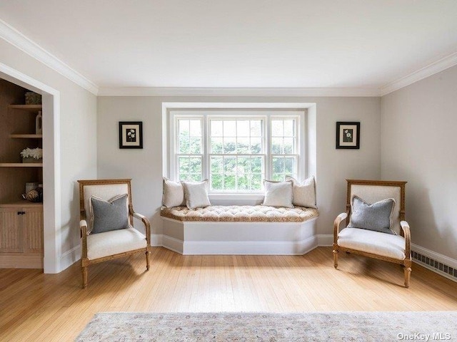 22 Homer Pl, Manhasset, NY 11030 - sitting room featuring wood finished floors, ornamental molding, and baseboards