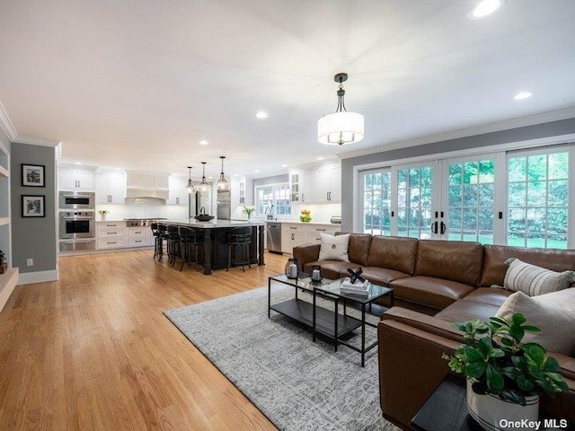 22 Homer Pl, Manhasset, NY 11030 - living room featuring crown molding, recessed lighting, and light wood-style flooring