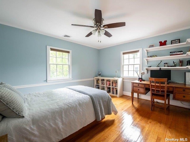 22 Homer Pl, Manhasset, NY 11030 - bedroom with ornamental molding, light wood-style floors, baseboards, a desk, and a ceiling fan