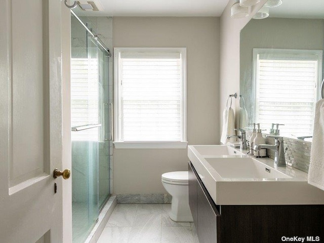 22 Homer Pl, Manhasset, NY 11030 - bathroom featuring toilet, a stall shower, vanity, and marble look tiles
