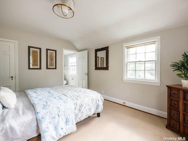 22 Homer Pl, Manhasset, NY 11030 - bedroom featuring lofted ceiling, baseboards, and light carpet