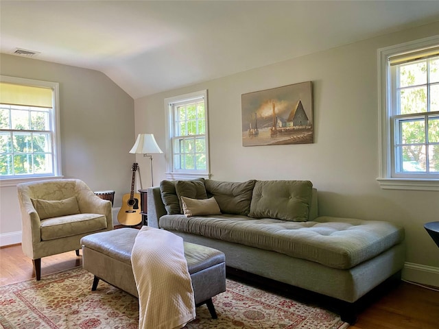 22 Homer Pl, Manhasset, NY 11030 - living area featuring wood finished floors, lofted ceiling, and baseboards