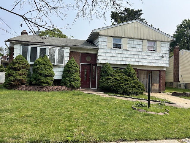 1109 Cramer Ct, North Baldwin, NY 11510 - tri-level home with a front yard and brick siding