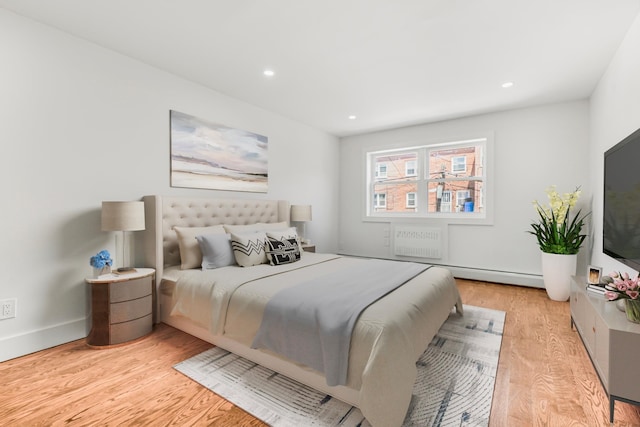 567 E 80th St, Brooklyn, NY 11236 - bedroom featuring light wood-style floors, recessed lighting, and a baseboard heating unit