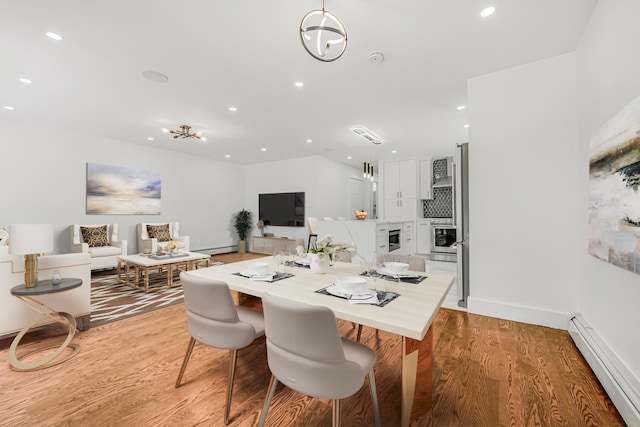 567 E 80th St, Brooklyn, NY 11236 - dining room with a baseboard radiator, light wood-style floors, recessed lighting, baseboards, and wine cooler