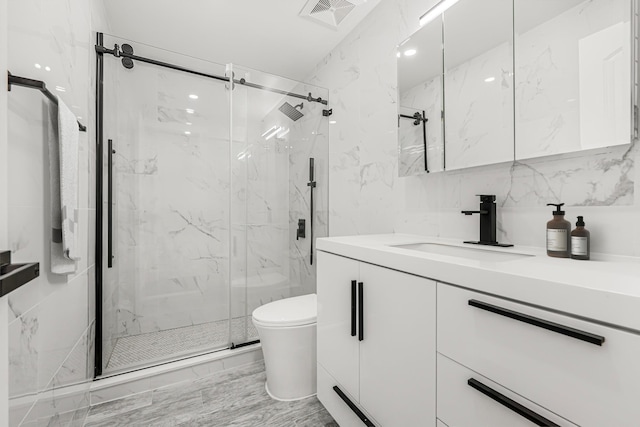 567 E 80th St, Brooklyn, NY 11236 - full bathroom featuring vanity, a marble finish shower, toilet, and tile walls