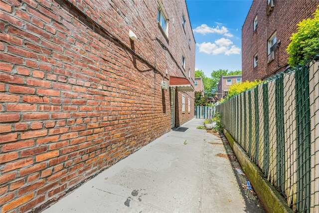 567 E 80th St, Brooklyn, NY 11236 - view of home's exterior with brick siding and a patio