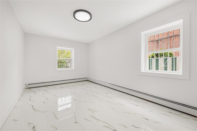 567 E 80th St, Brooklyn, NY 11236 - empty room with light marble finish floors, baseboards, and a baseboard radiator