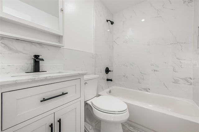 567 E 80th St, Brooklyn, NY 11236 - bathroom featuring vanity, toilet, washtub / shower combination, and marble look tiles