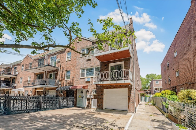 567 E 80th St, Brooklyn, NY 11236 - multi unit property featuring brick siding, an attached garage, and concrete driveway