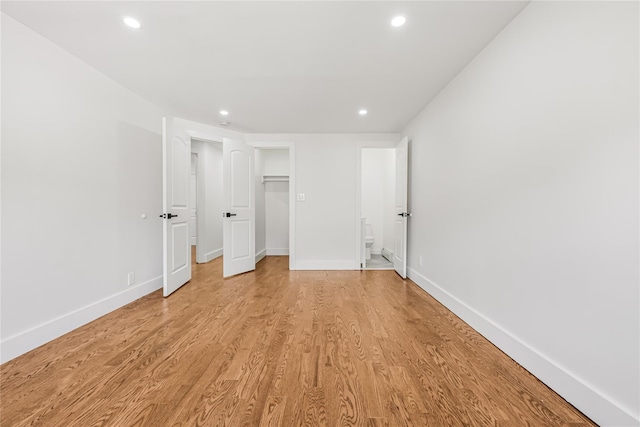 567 E 80th St, Brooklyn, NY 11236 - unfurnished bedroom with recessed lighting, light wood finished floors, baseboards, a closet, and ensuite bathroom