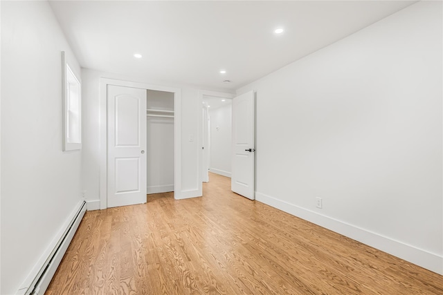 567 E 80th St, Brooklyn, NY 11236 - unfurnished bedroom with a baseboard heating unit, light wood finished floors, recessed lighting, a closet, and baseboards