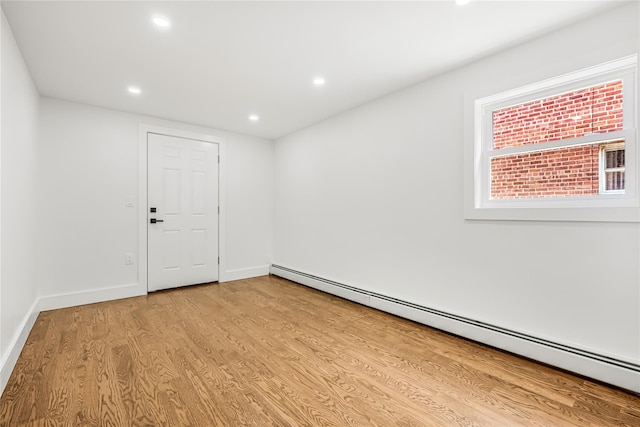 567 E 80th St, Brooklyn, NY 11236 - spare room featuring a baseboard radiator, wood finished floors, recessed lighting, and baseboards