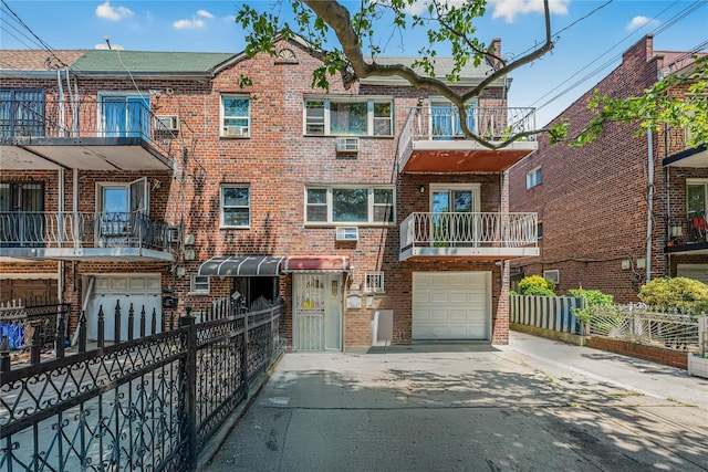 567 E 80th St, Brooklyn, NY 11236 - view of front facade with a garage, brick siding, and concrete driveway