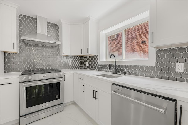 567 E 80th St, Brooklyn, NY 11236 - kitchen with appliances with stainless steel finishes, wall chimney range hood, a sink, and white cabinets