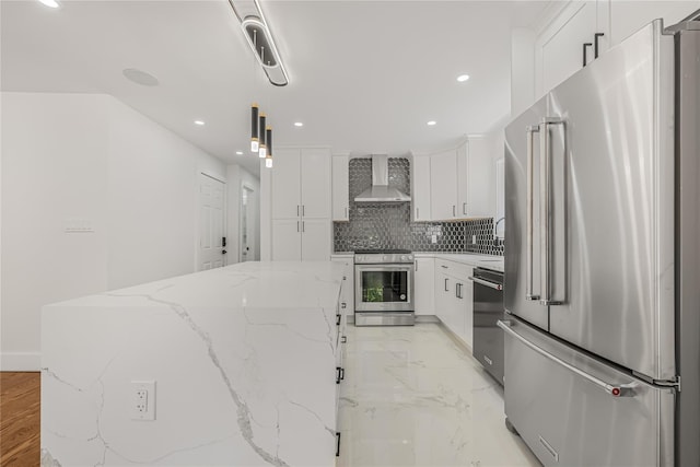 567 E 80th St, Brooklyn, NY 11236 - kitchen featuring stainless steel appliances, wall chimney range hood, decorative backsplash, white cabinets, and a kitchen island