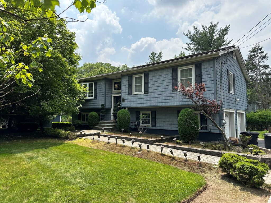 43 N Lorna Ln, Airmont, NY 10901 - raised ranch featuring a garage and a front yard