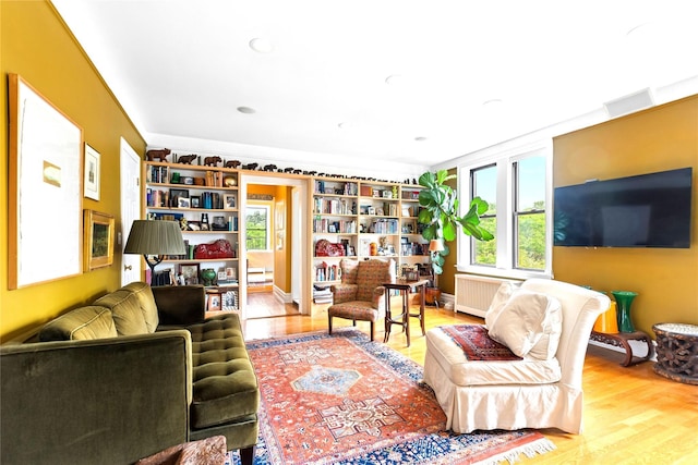 690 Riverside Dr Unit 5E, New York Manhattan, NY 10031 - living room featuring radiator and wood finished floors