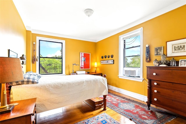 690 Riverside Dr Unit 5E, New York Manhattan, NY 10031 - bedroom featuring multiple windows, wood finished floors, and baseboards