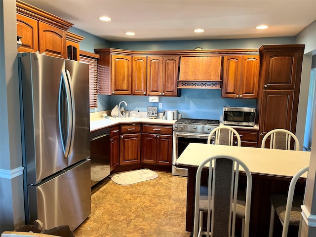 70 Pacific St, North Babylon, NY 11703 - kitchen featuring stainless steel appliances, light countertops, a kitchen breakfast bar, recessed lighting, and light floors