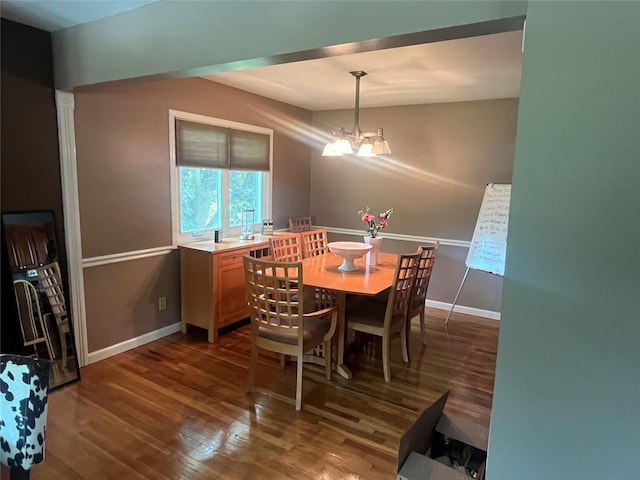 70 Pacific St, North Babylon, NY 11703 - dining area with dark wood-style flooring and a chandelier