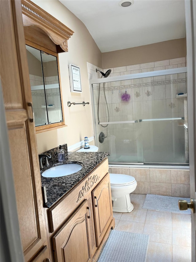 70 Pacific St, North Babylon, NY 11703 - full bathroom featuring tiled shower / bath combo, vanity, and tile patterned floors
