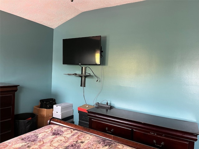 70 Pacific St, North Babylon, NY 11703 - bedroom with lofted ceiling and a textured ceiling