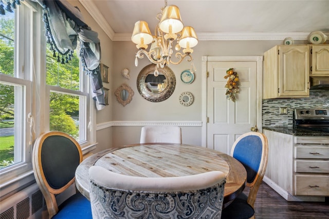24 Pine St, Lake Grove, NY 11755 - dining space featuring ornamental molding, a chandelier, and dark wood-style flooring