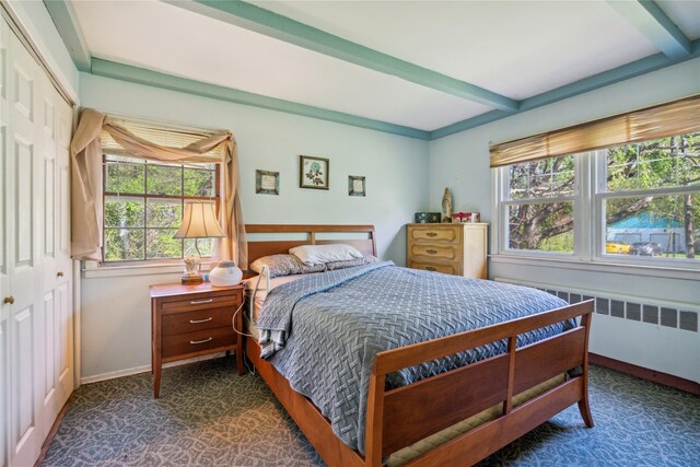24 Pine St, Lake Grove, NY 11755 - bedroom with beam ceiling, radiator, dark carpet, baseboards, and a closet