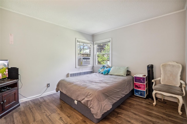 24 Pine St, Lake Grove, NY 11755 - bedroom with radiator heating unit, dark wood-style floors, ornamental molding, cooling unit, and baseboards