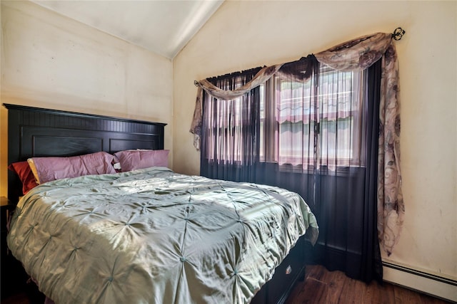 24 Pine St, Lake Grove, NY 11755 - bedroom with a baseboard heating unit, vaulted ceiling, and wood finished floors