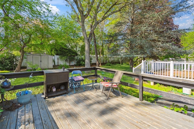 24 Pine St, Lake Grove, NY 11755 - wooden deck with an outdoor fire pit and a fenced backyard